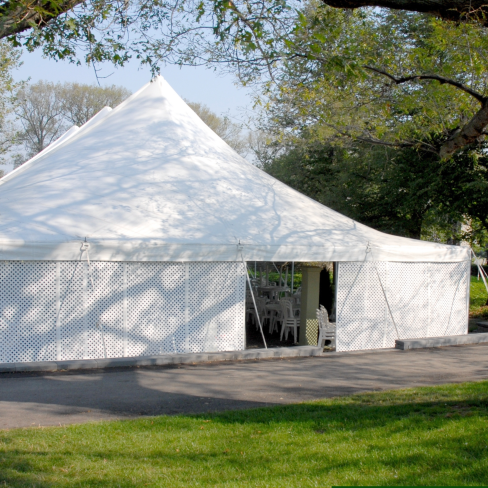 A white tent in a park